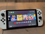 Nintendo Switch OLED - Blanche, Games en Spelcomputers, Spelcomputers | Nintendo Switch, Ophalen, Zo goed als nieuw, Met 2 controllers