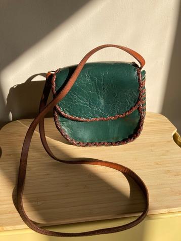 Groene lederen handtas beschikbaar voor biedingen