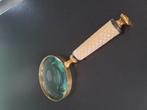 Antiek vergrootglas, Ophalen