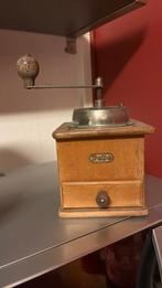 Antiek manuele koffie molen, Ophalen