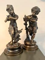 Bronzen beelden jongen en meisje, Ophalen