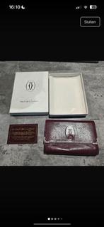 Cartier portefeuille, Ophalen