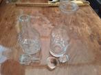 2 glazen flacons, Ophalen