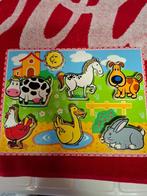 Houten insteekpuzzel, Ophalen