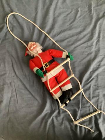 Kerstman op ladder beschikbaar voor biedingen