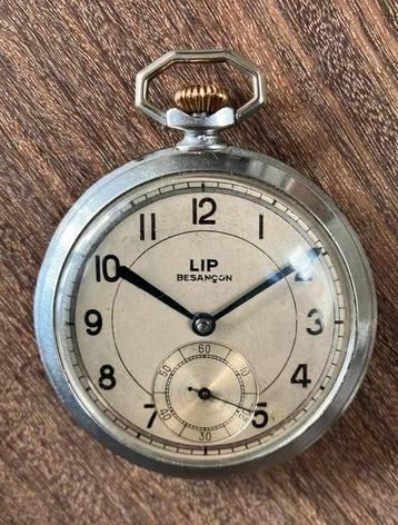 Antieke zakhorloge van LIP Beçancon in metalen etui beschikbaar voor biedingen