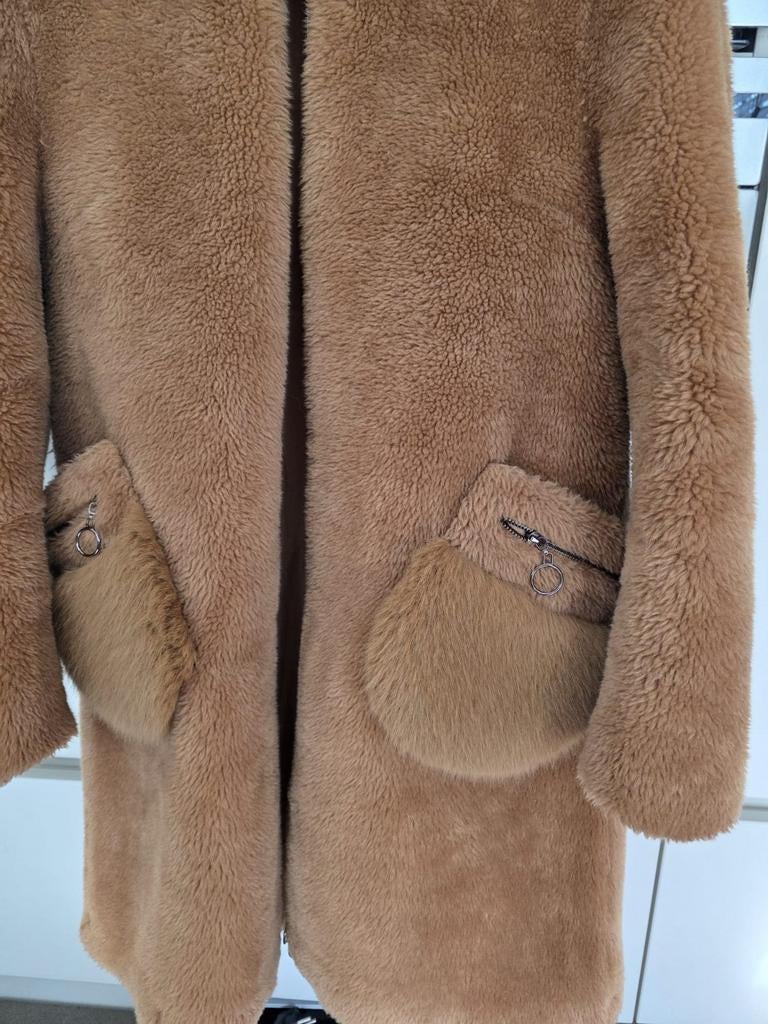 Manteau en laine, Enlèvement