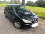 Peugeot 206 1100cc benzine MOD 2004 zwart ctok, Auto's, Voorwielaandrijving, Stof, Zwart, 4 cilinders