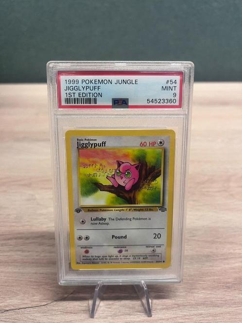 Jigglypuff 1st Edition PSA 9 - 54/64 - Jungle, Hobby en Vrije tijd, Verzamelkaartspellen | Pokémon, Zo goed als nieuw, Losse kaart