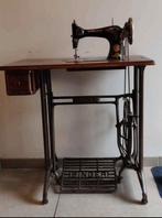 Antieke naaimachine Singer, Ophalen