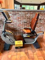 Professionele hometrainer rugleuning van Technogym, Ophalen, Zo goed als nieuw