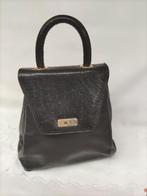 Zwarte lederen schoudertas, Enlèvement