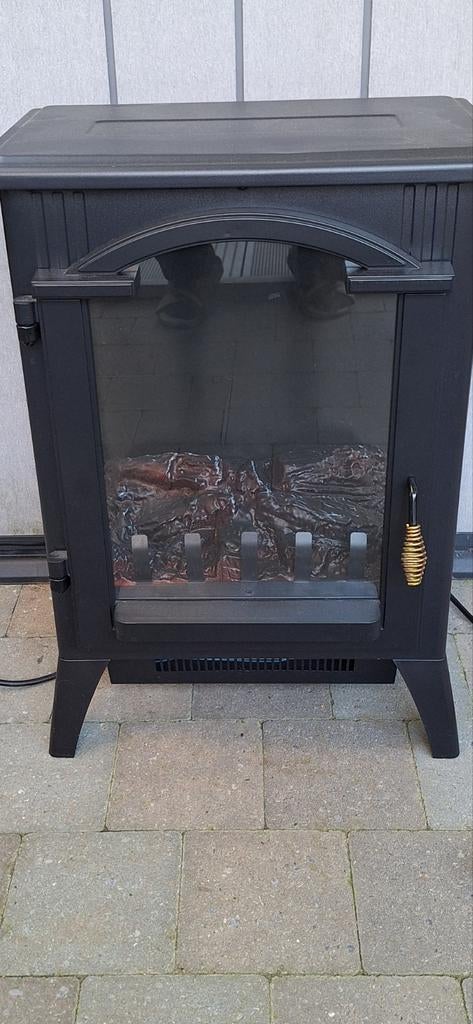 Elektrisch en gezellig kacheltje met warme luchtblazer, Ophalen
