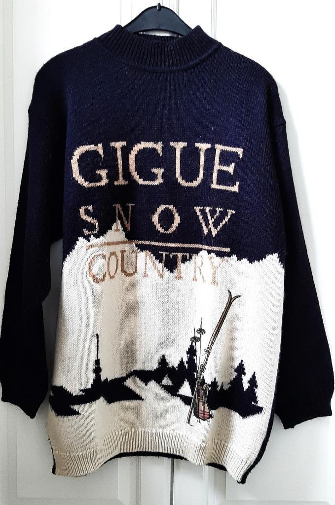 Te koop: Mooie zwarte wintertrui van "Gigue" met applicatie., Kleding | Dames, Truien en Vesten, Zo goed als nieuw, Maat 42/44 (L)