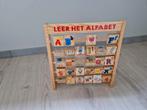 Houten leer het alfabetbord, Ophalen