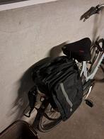 Dubbele fietstas, Ophalen