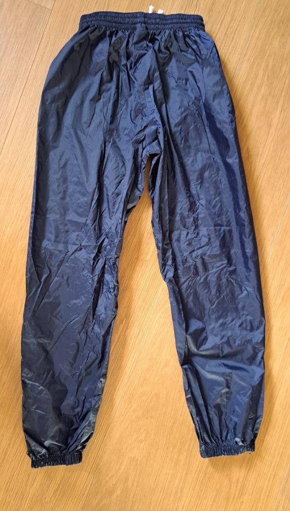 Quechua regenbroek 12 jaar oud — nieuw!, Caravans en Kamperen, Regenkleding, Nieuw, Regenbroek, Kinderen, Ophalen of Verzenden