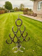 Kerstboompje met hoefijzers, Ophalen