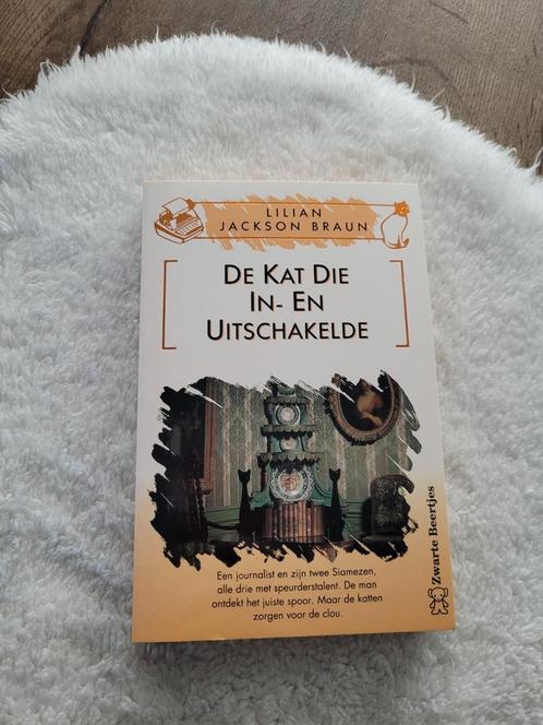 Lillian Jackson Braun - De kat die in- en uitschakelde, Boeken, Thrillers, Zo goed als nieuw, België, Ophalen of Verzenden