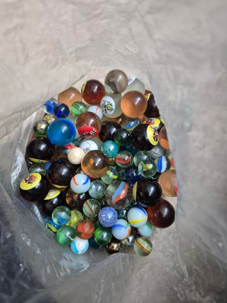 Zak knikkers, Ophalen