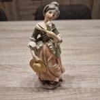Poreslein beeld vrouw met hoed en bloem, Ophalen