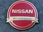 NISSAN 50TH ANNIVERSARY CAR BADGE RED. NEW, Ophalen of Verzenden, Zo goed als nieuw, Auto's
