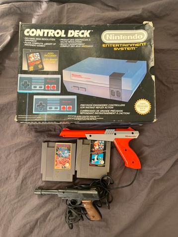 Nintendo NES in doos met games en accessoires beschikbaar voor biedingen