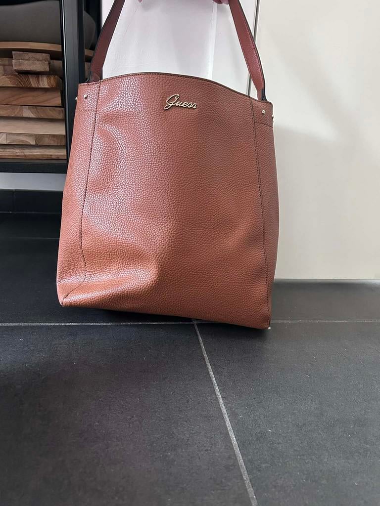 Hadtas Guess, Ophalen, Zo goed als nieuw