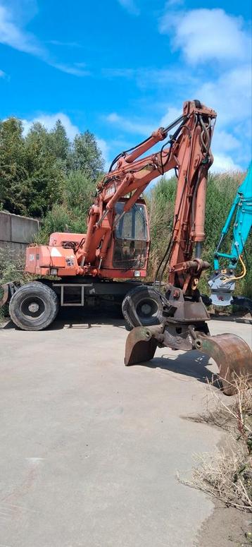 Atlas 1204 bandenkraan met sorteergrijper, Enlèvement