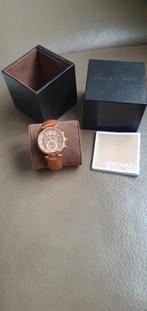 Heren michael kors horloge, Enlèvement