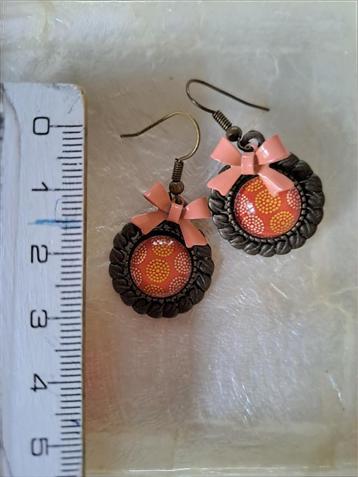 oranje oorbellen beschikbaar voor biedingen