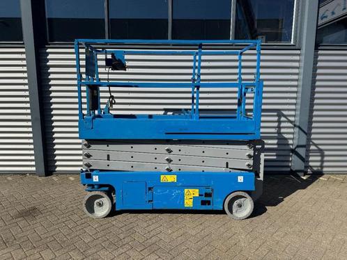 Genie GS2632 Hoogwerker Schaarhoogwerker (bj 2010), Zakelijke goederen, Machines en Bouw | Liften, Steigers en Ladders