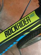 VTT ROCKRIDER 340 BLEU JAUNE QUASI NEUF vendu comme sur les, Enlèvement, Comme neuf