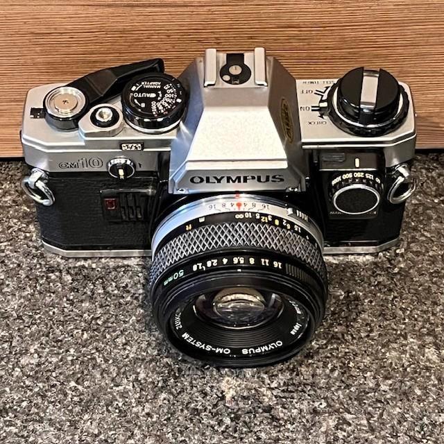 Olympus OM10 analoge camera + lenzen + set + koffer, Audio, Tv en Foto, Fotocamera's Analoog, Gebruikt, Spiegelreflex, Olympus