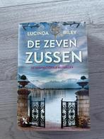 De zeven zussen - Lucinda Riley (Nederlands), Boeken, Romans, Ophalen of Verzenden, Zo goed als nieuw, Lucinda Riley