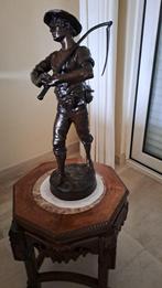 Bronzen beeld, Ophalen