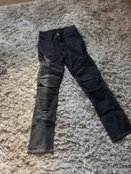 Nieuwe motorjeansbroek, Ophalen