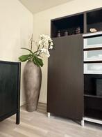 grote aardewerk kruik, Ophalen