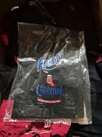 Fristi schort, Envoi, Tablier