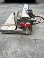 Tegelzaagmachine, Ophalen