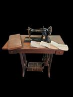 Antieke singer naaimachine, Ophalen