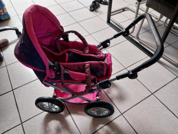 poppenbuggy met draagzak roze  beschikbaar voor biedingen