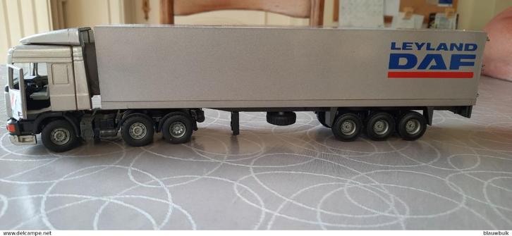 Tekno Leyland/Daf 95 430 pk zilveren trekker met 3 assen en, Hobby en Vrije tijd, Modelauto's | 1:50, Zo goed als nieuw, Bus of Vrachtwagen