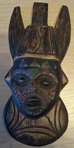 art africain : décoration ou petit masque ?, Ophalen