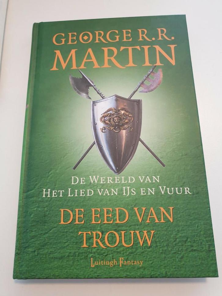 George R.R. Martin - De eed van trouw, Boeken, Fantasy, Zo goed als nieuw, Ophalen of Verzenden