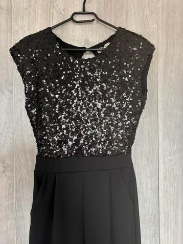 Zwarte jumpsuit met glitter paletten beschikbaar voor biedingen