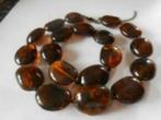 Avon: de set „Chocolate” (ketting + armband), Ophalen of Verzenden, Nieuw, Bruin