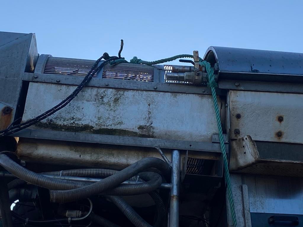 Garnaal spoelmachine, Ophalen