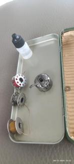 Spoelen van een oud naaimachine, Telecommunicatie, Ophalen