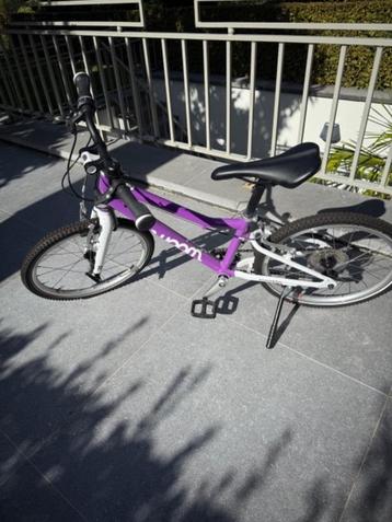 Woom fiets maat 4 paars 7 speed met bel en voet beschikbaar voor biedingen